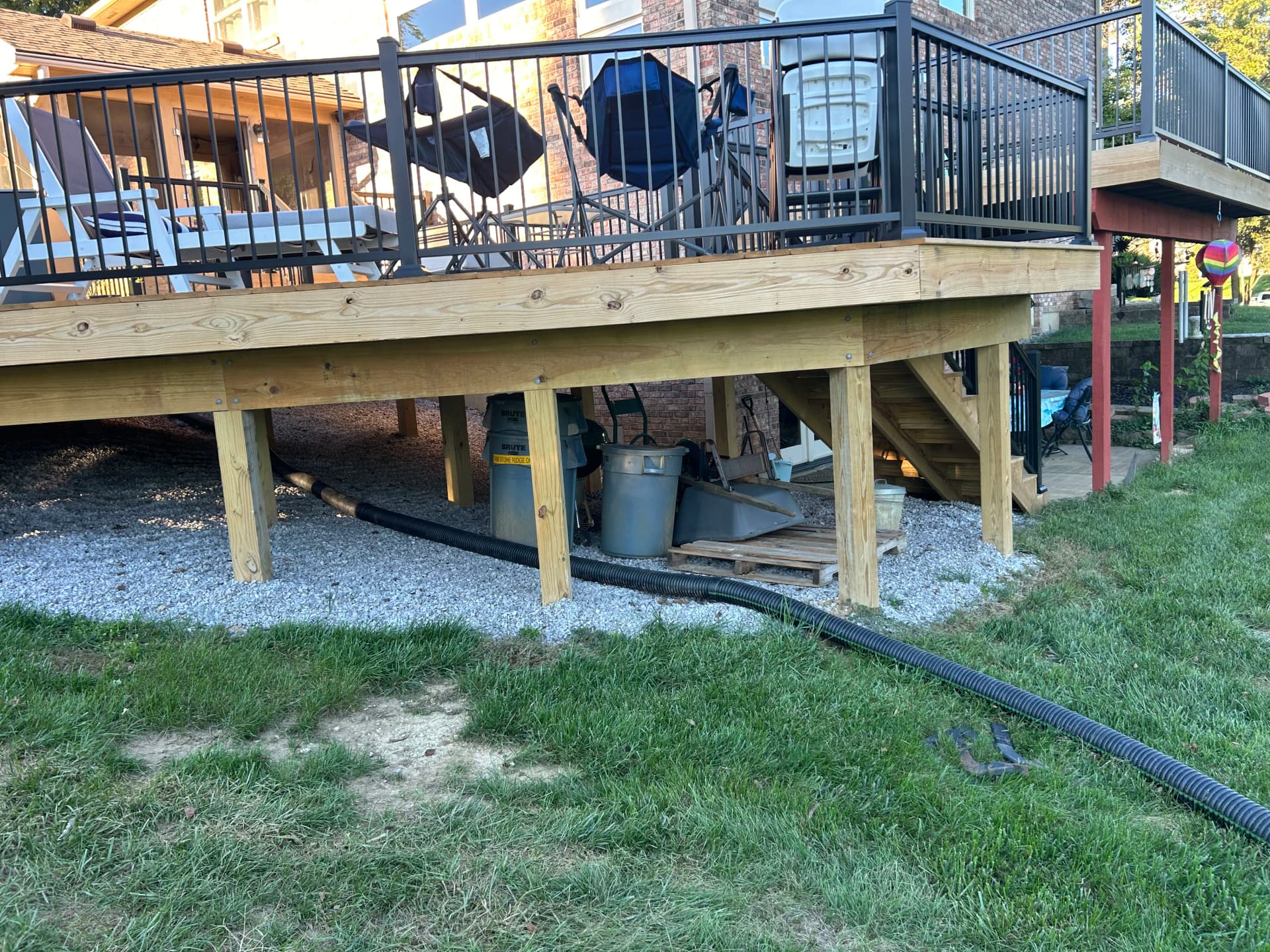 Gravel Under the Deck and Fresh Mulch Beds at the Driveway