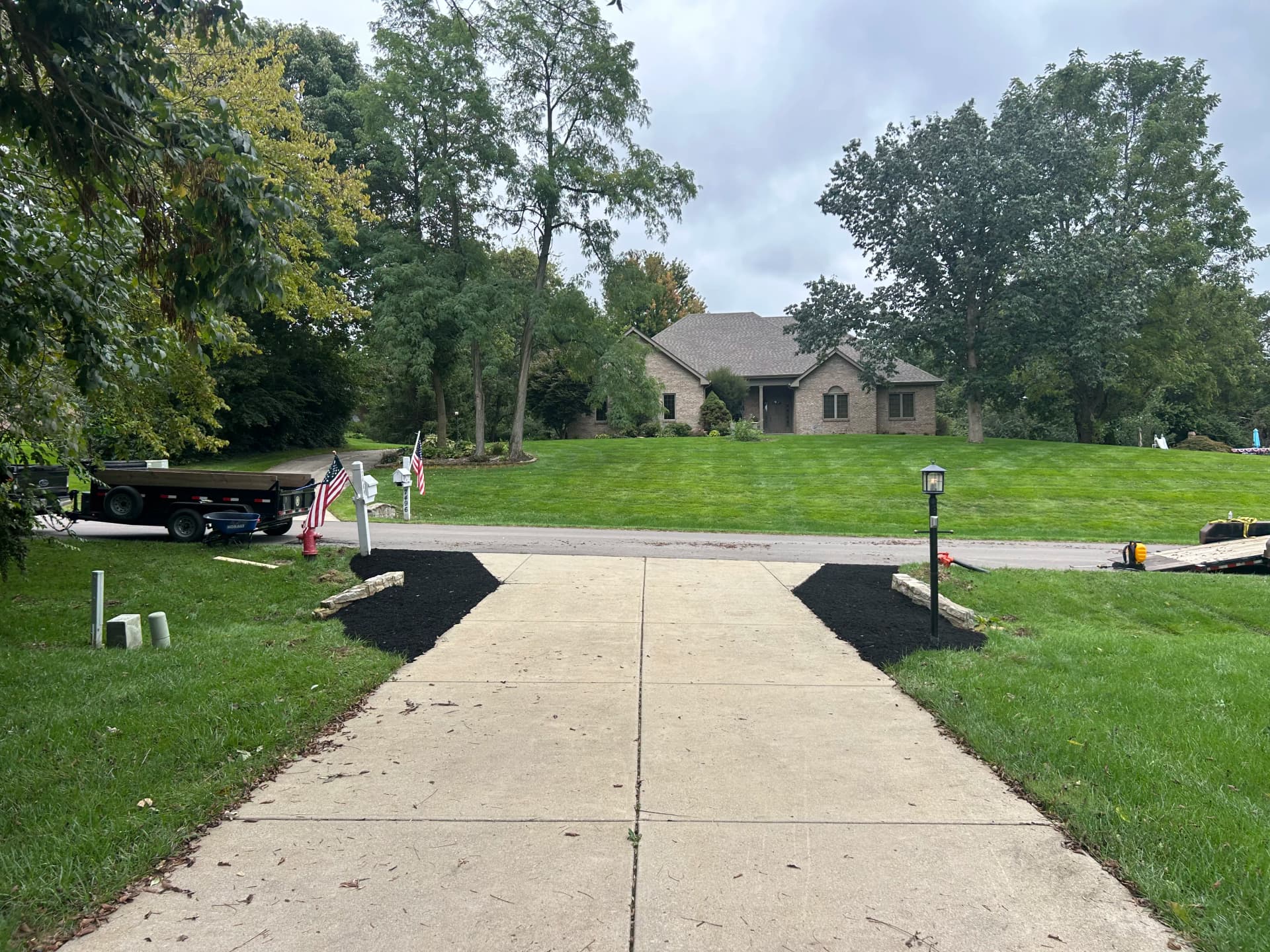 Gravel Under the Deck and Fresh Mulch Beds at the Driveway