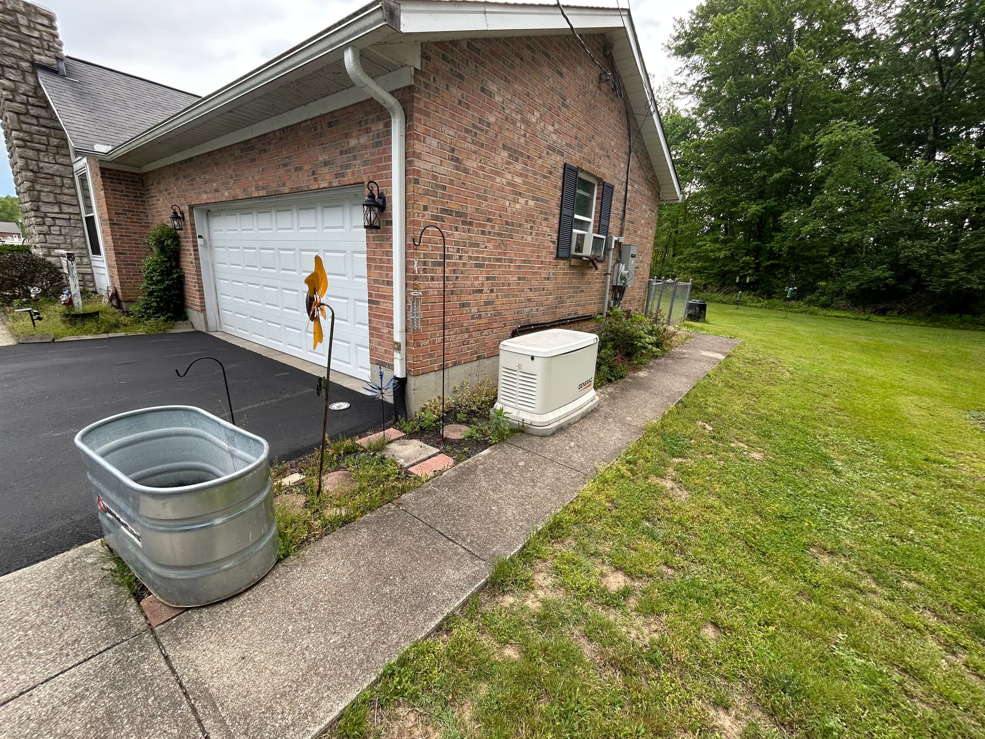 Sidewalk Extension, Paver Work, and Rock Bed Upgrade for Cleaner Curb Appeal